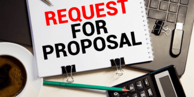 401(k) Request for Proposal Process - a sheet of paper sitting on an open laptop reads Request for Proposal