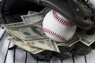 Baseball mit with baseball and money inside