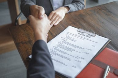 Interview hand shake with resume