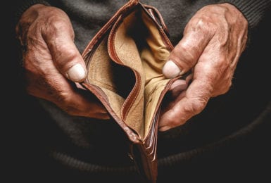 old-man-holding-empty-wallet